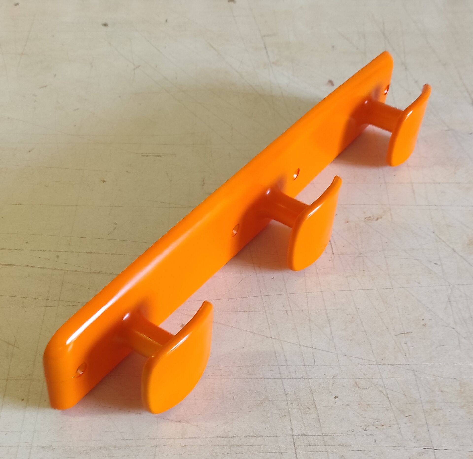 Orange wall coat rack by Syla - 1970s