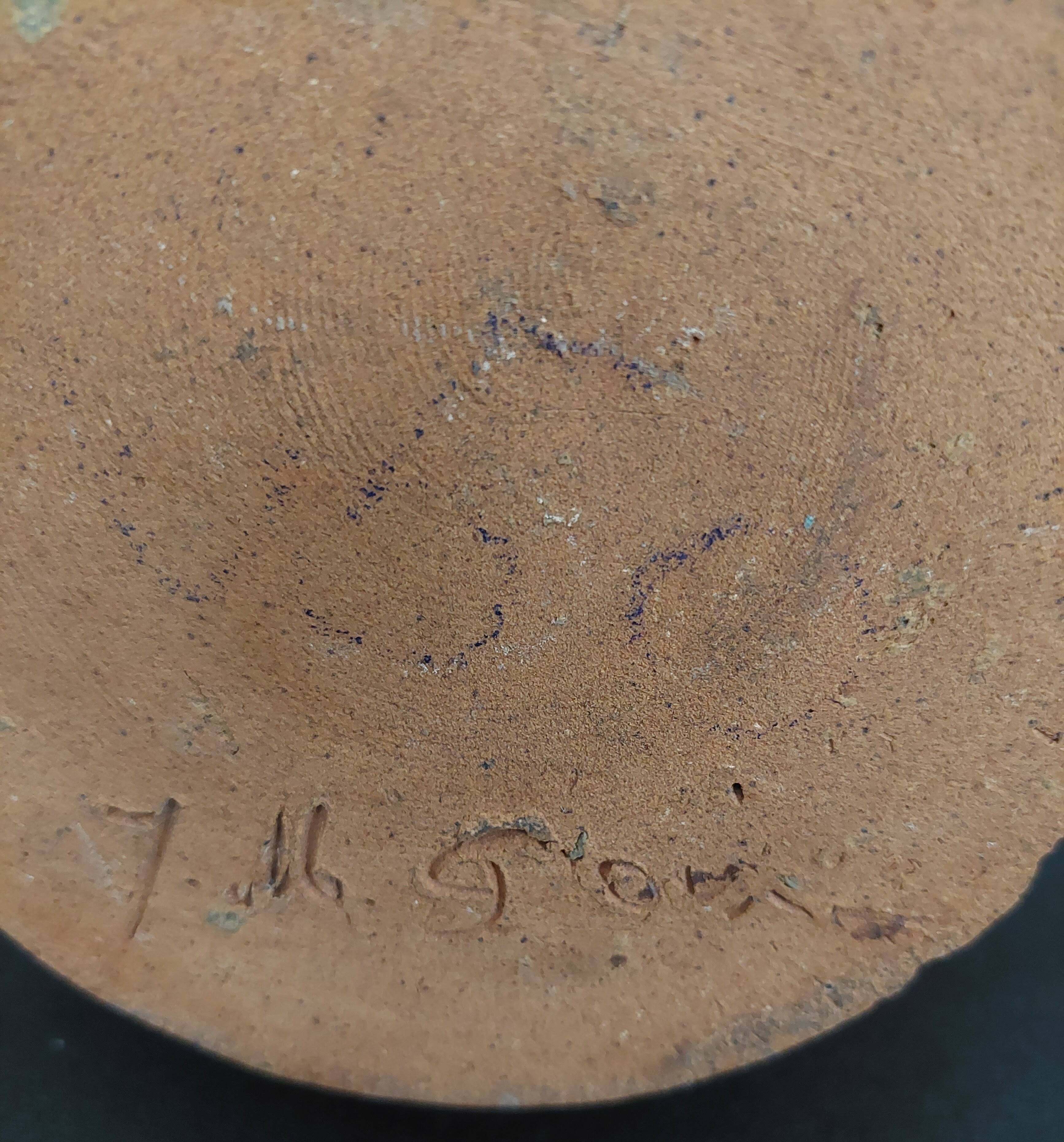 Vintage pitcher with a signature to identify.
