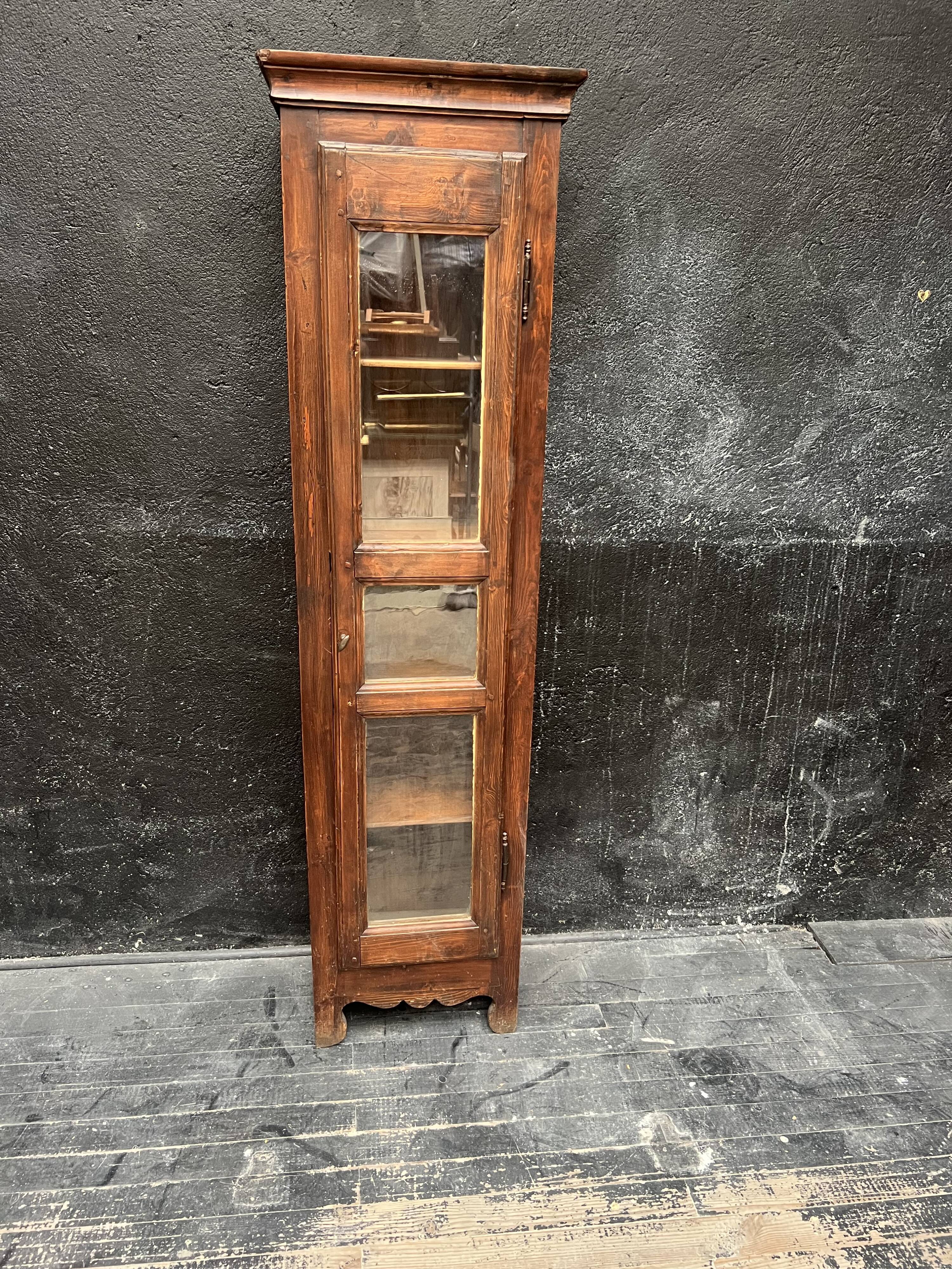 Old narrow wooden showcase.