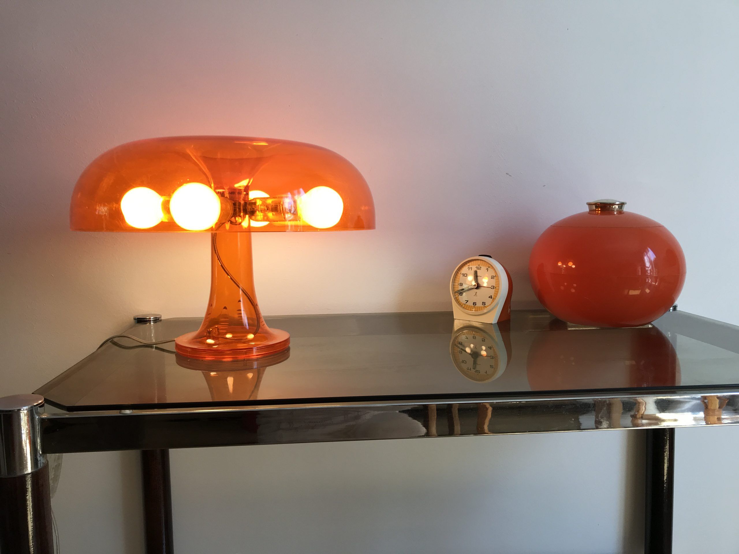 Orange nessino pose lamp for artemide by giancarlo mattioli
