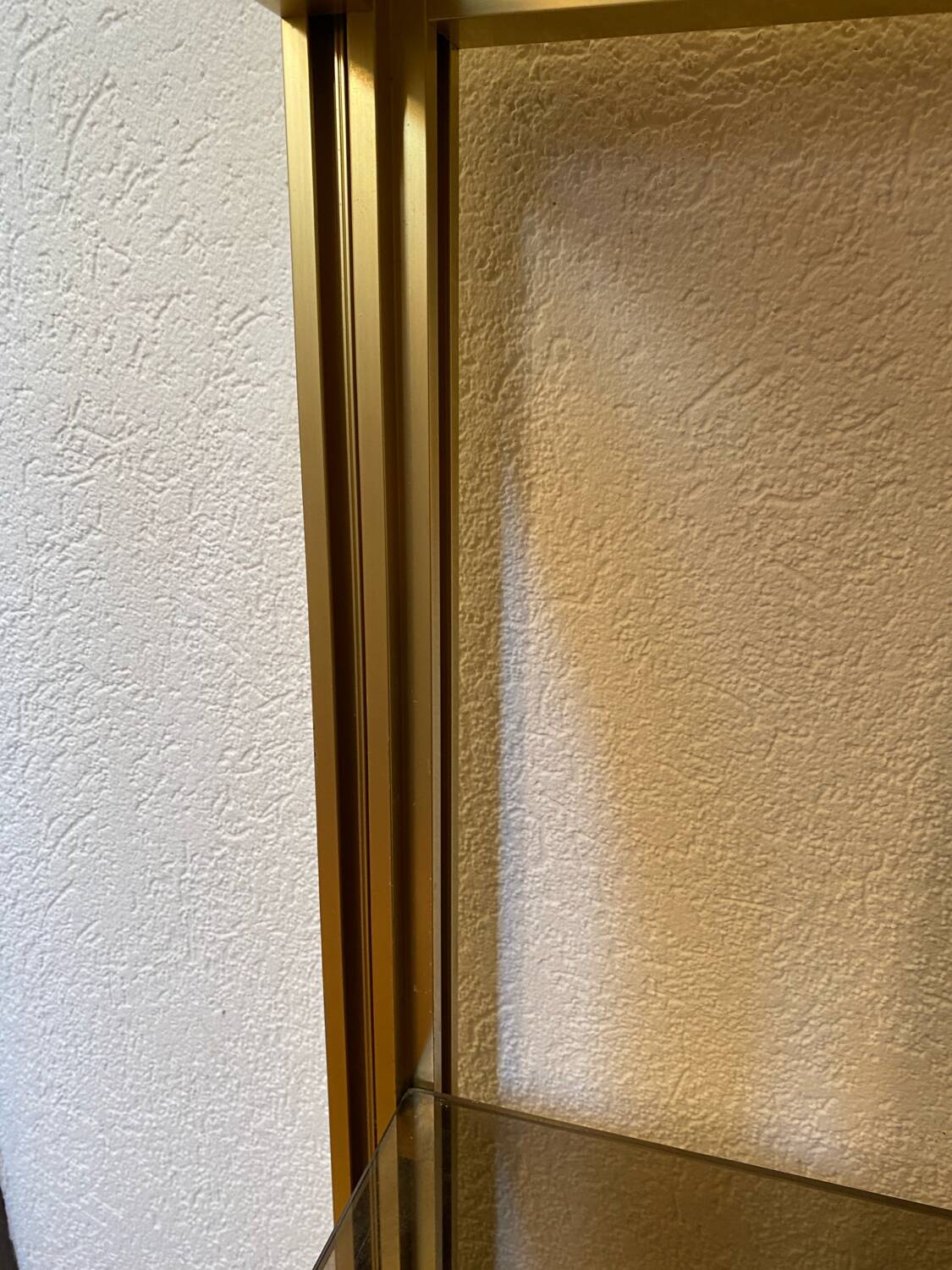 Regency style console table, in gilded metal and smoked glass