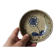 Ceramic bowl emptier with floral motif by suzanne dauliach