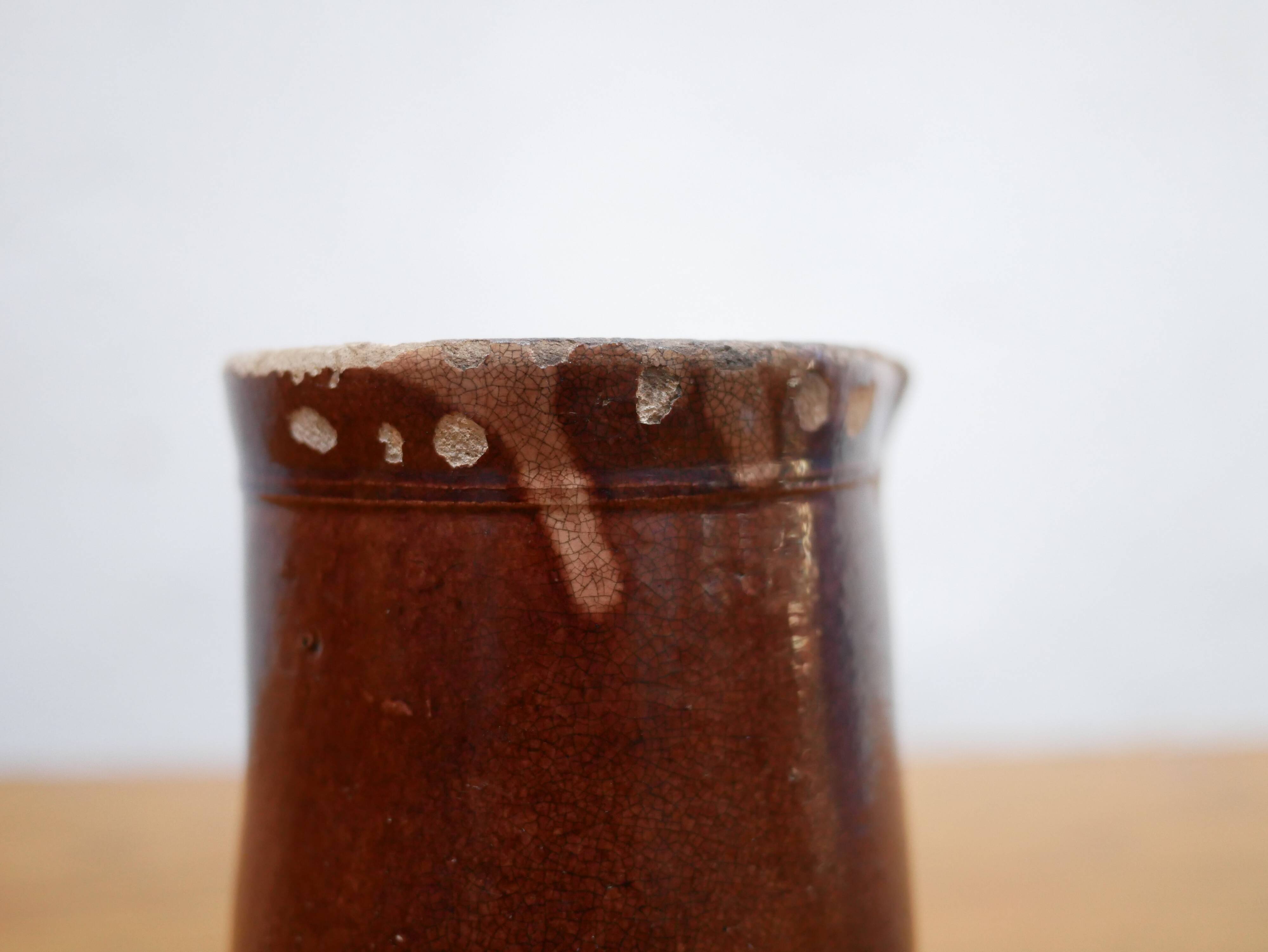 Vintage pitcher in glazed terracotta