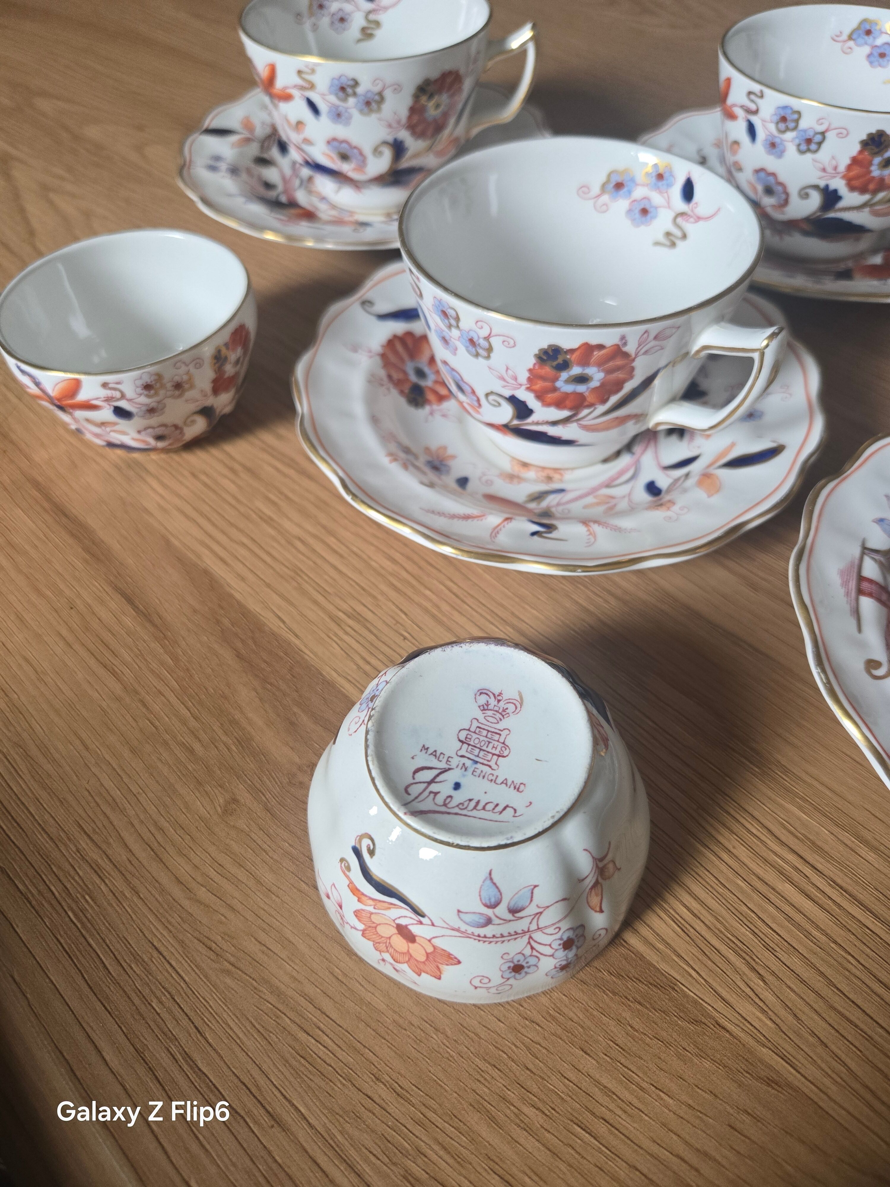 5 tea cups with saucers and 2 small pots, made in England.