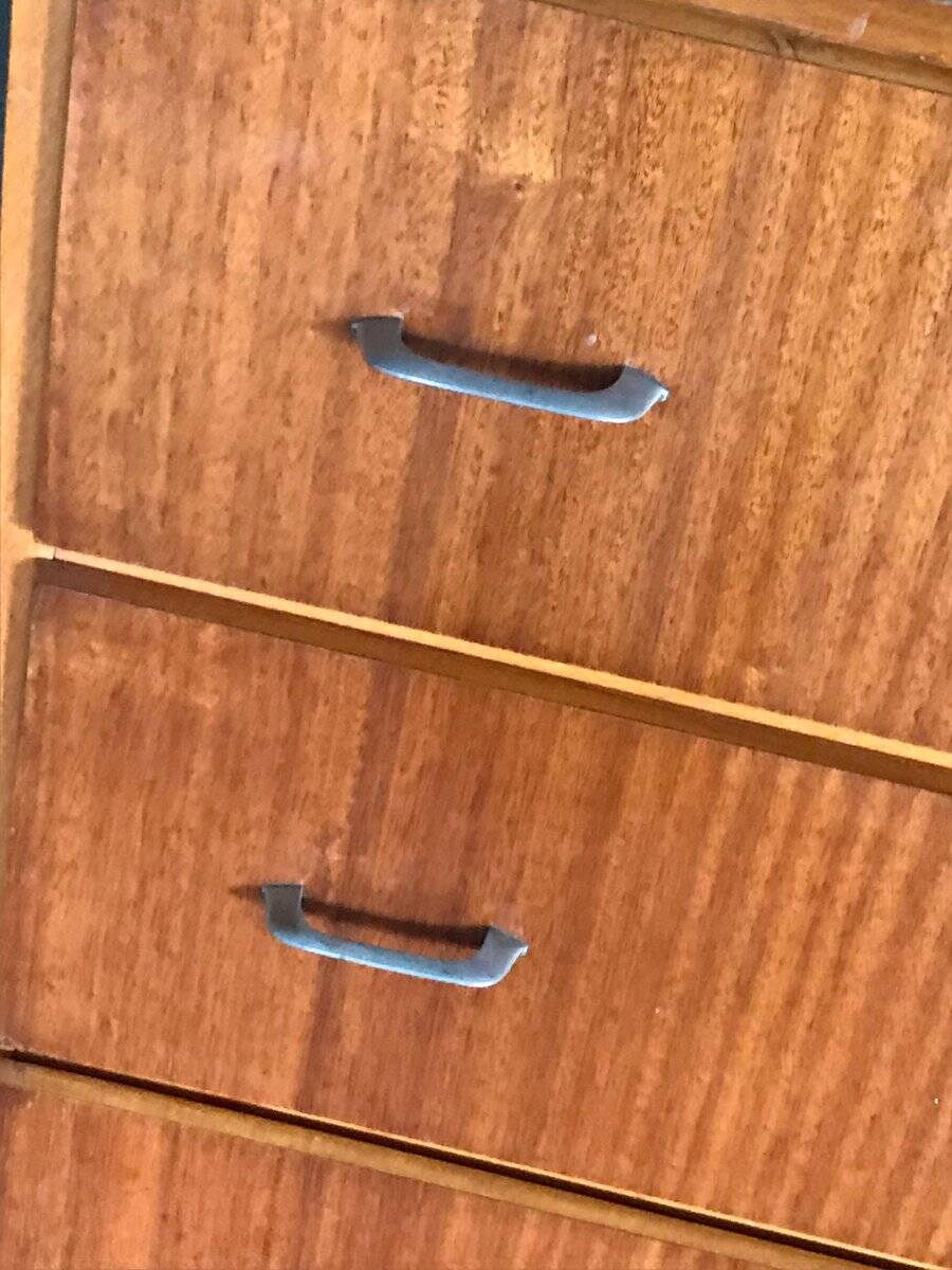 Vintage Scandinavian brown wooden chest of drawers with iron handles and 4 drawers, 1960s.