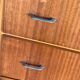 Vintage Scandinavian brown wooden chest of drawers with iron handles and 4 drawers, 1960s.