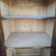 Small storage unit in solid wood and copper.