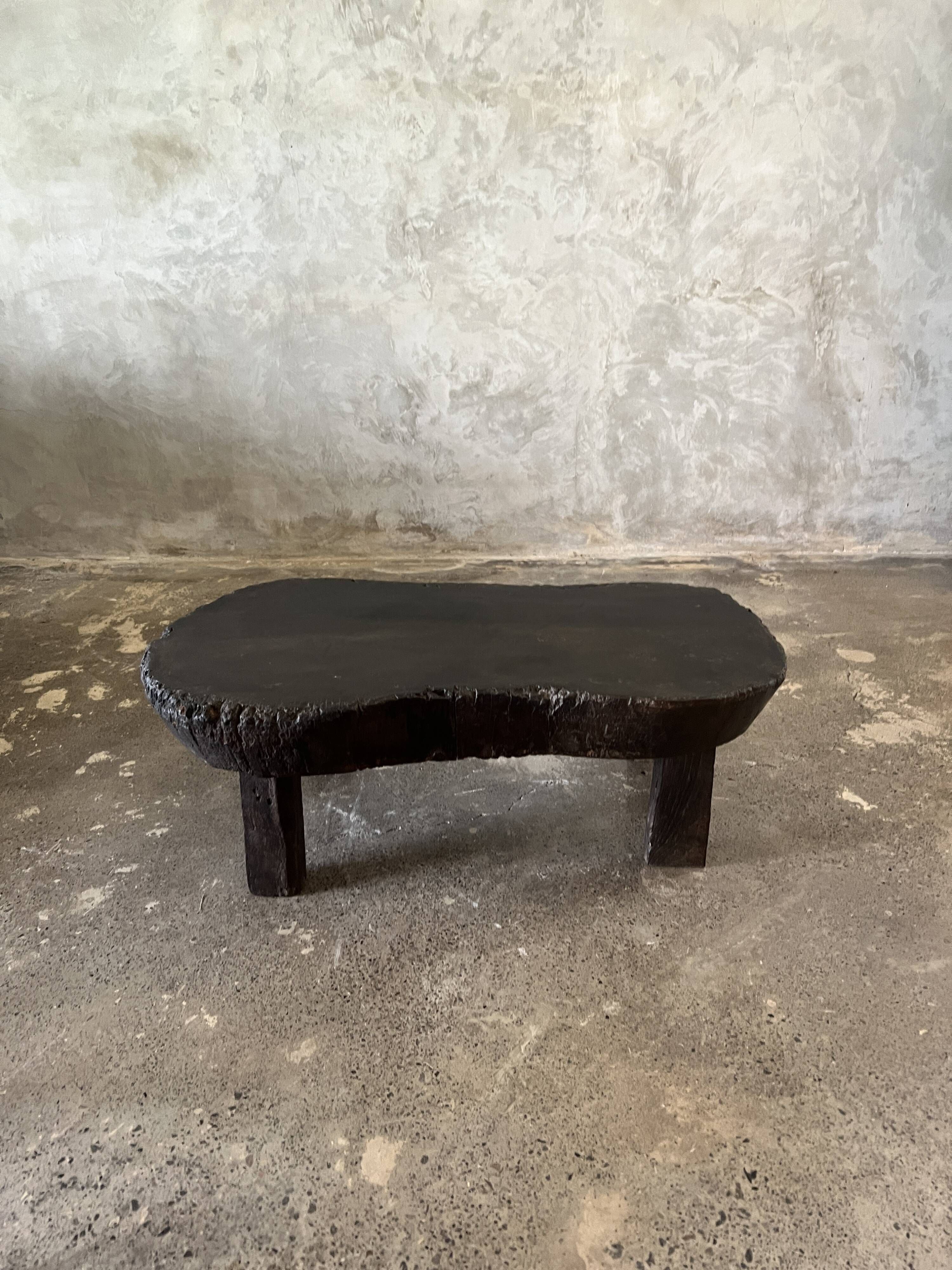 Small old Asian wooden coffee table in Japanese style, kidney-shaped top