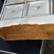 Small antique workshop cabinet with 8 painted wooden drawers.
