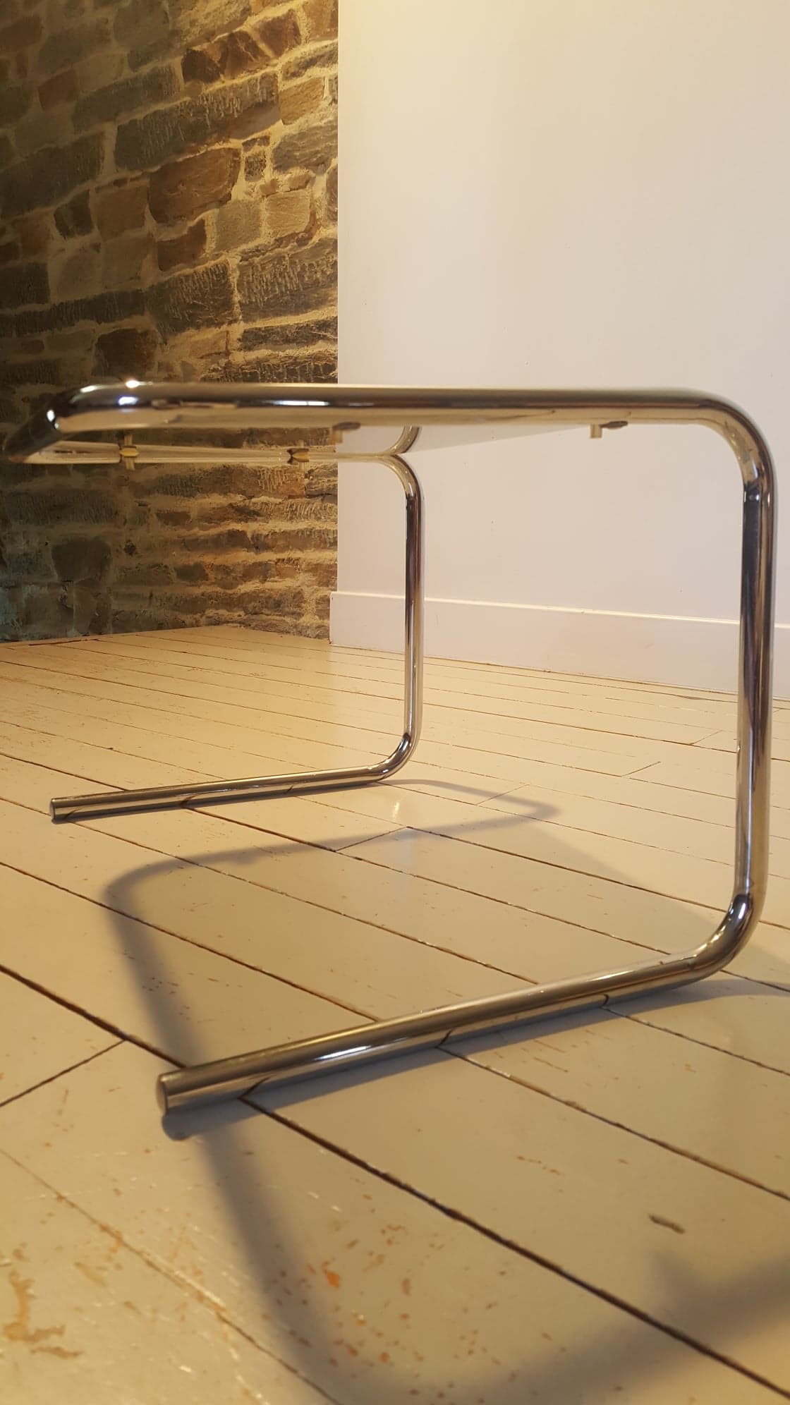 Smoked glass and chrome metal sofa tip