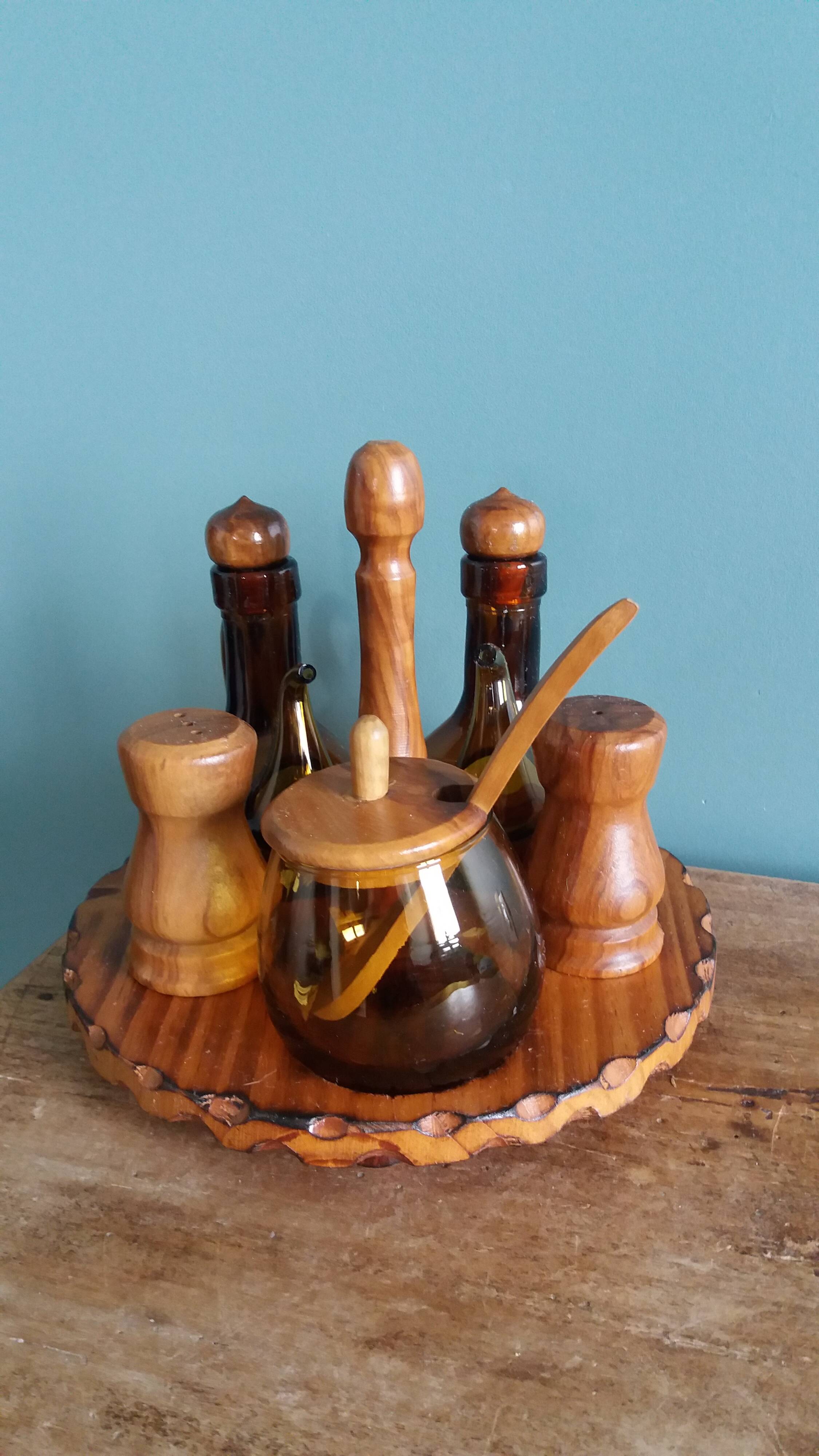 Oil, vinegar, mustard, pepper, salt, olive wood servant from Spain.