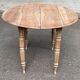 Renovated 18th century solid wood extendable round dining table with shutters
