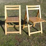 Pair of vintage folding chairs in light wood