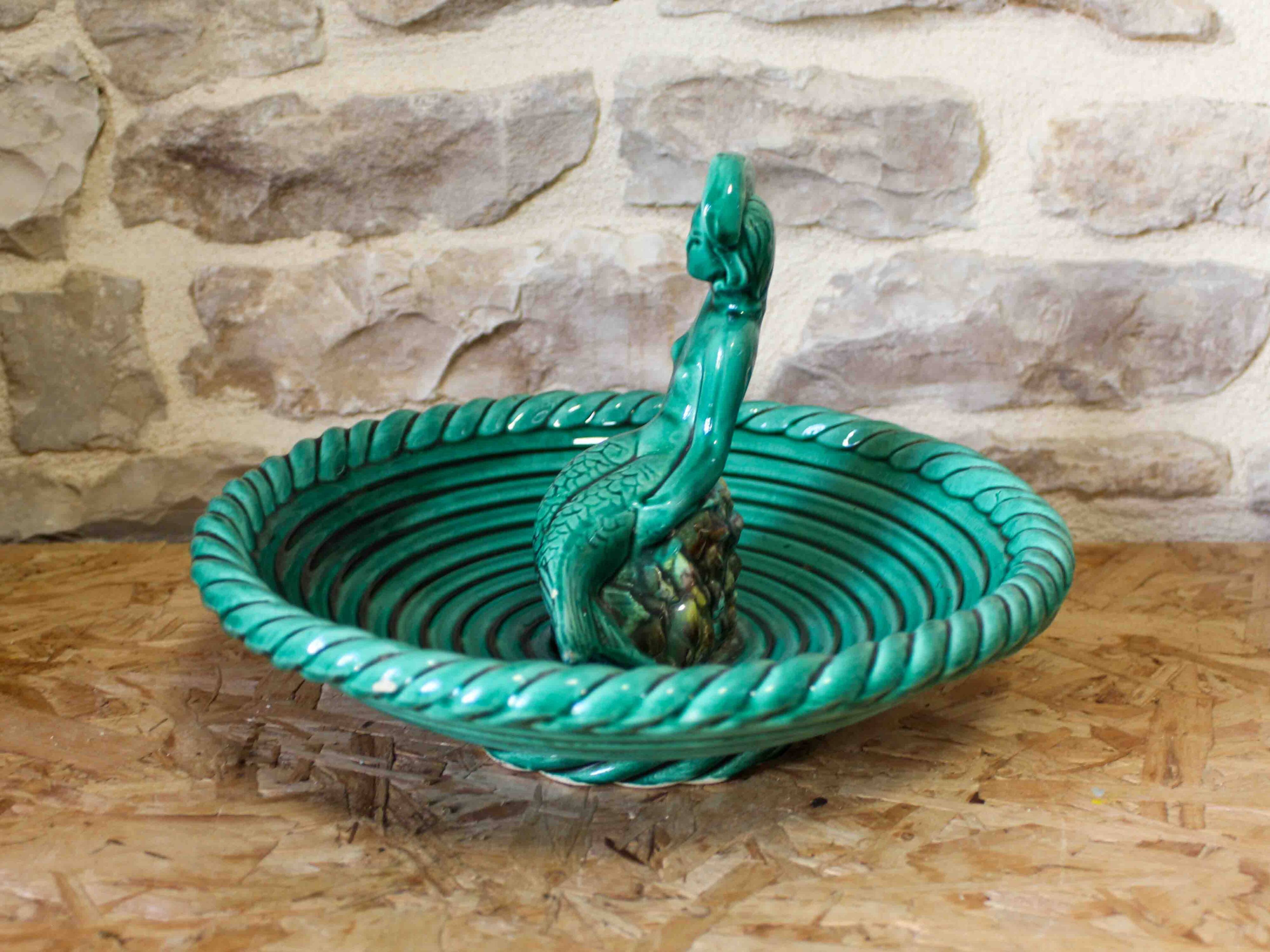 Ceramic cup with mermaid decoration