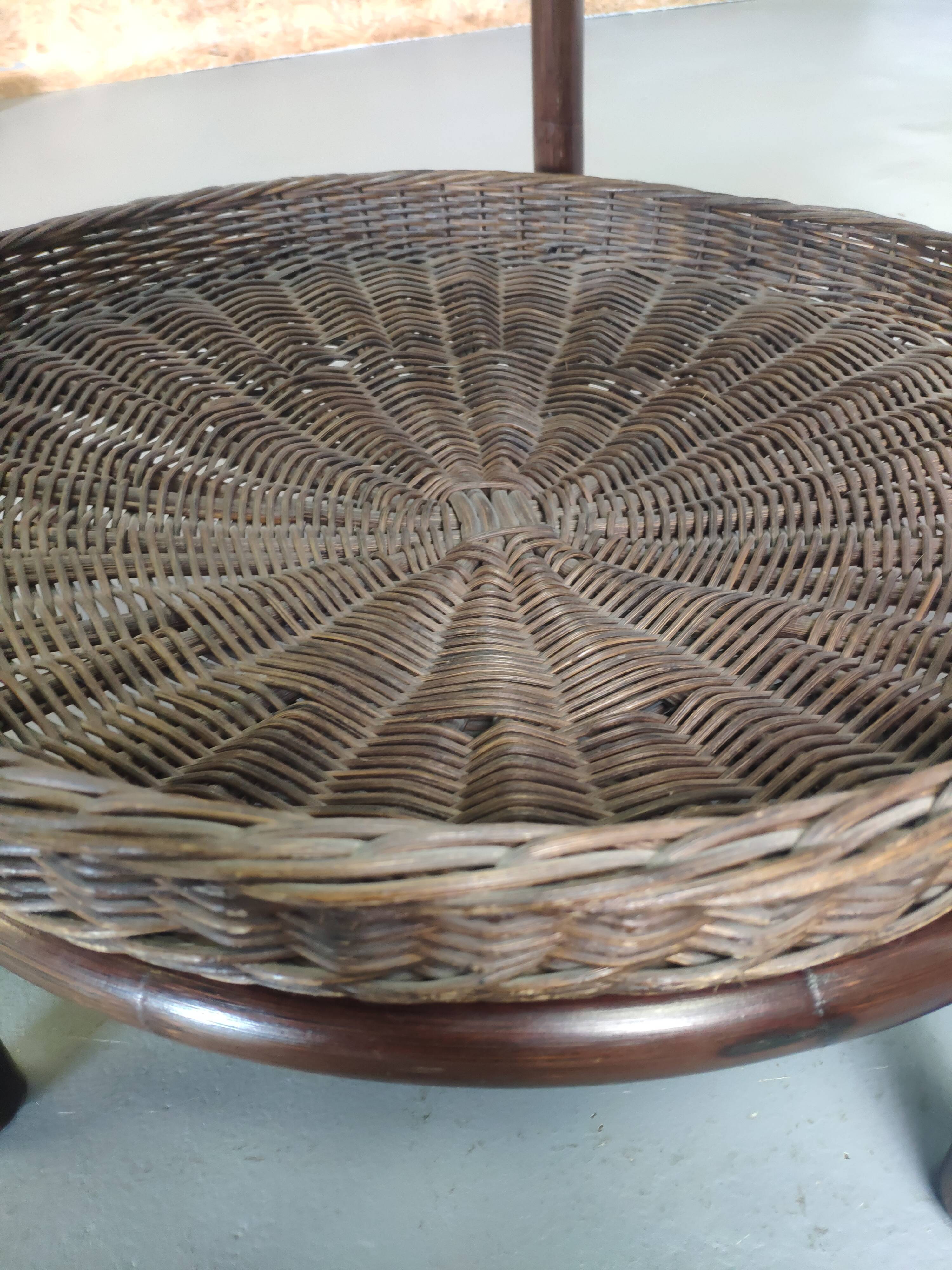 Vintage rattan coffee table with smoked glass top and rattan basket shelf