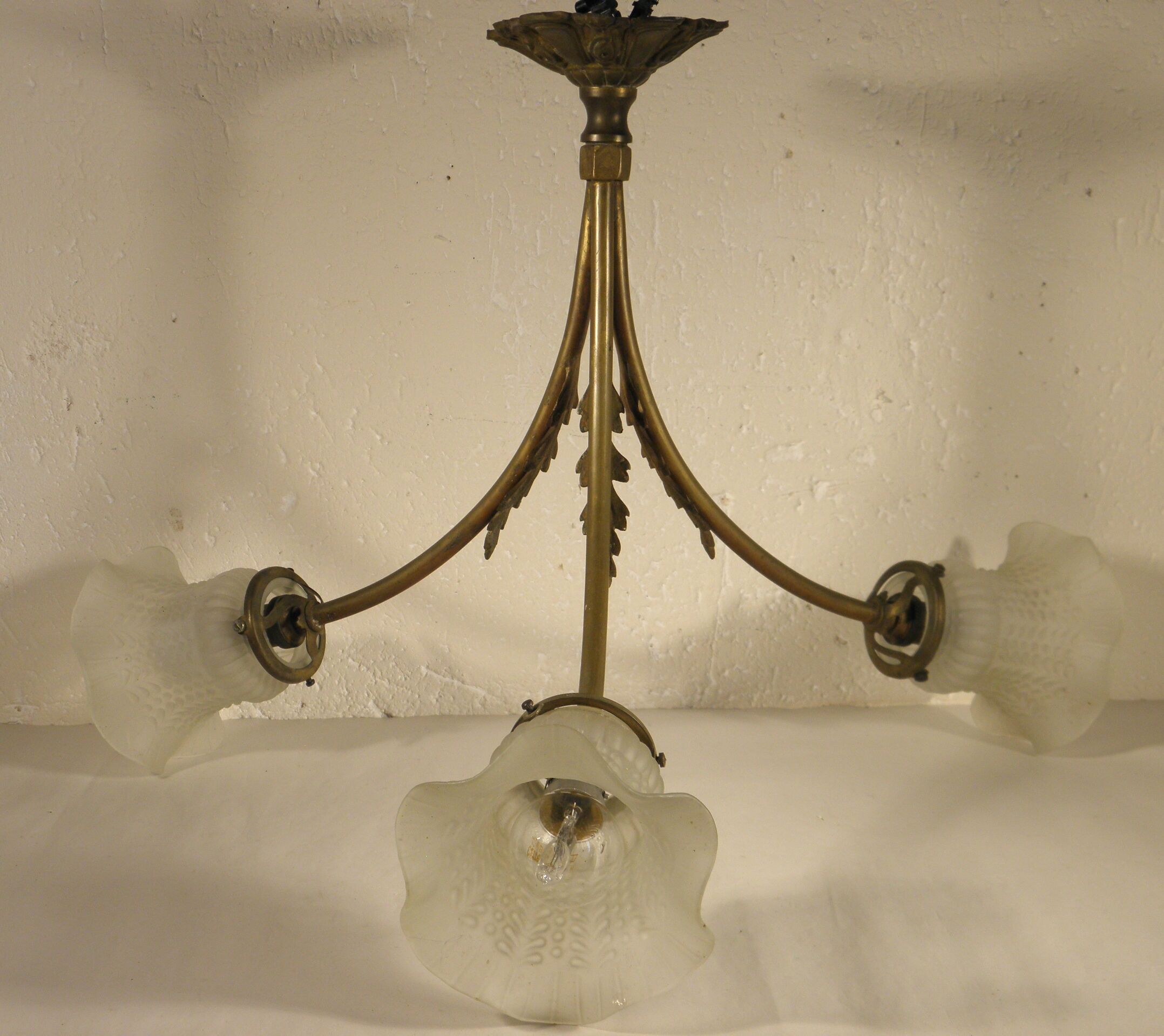 Three-spoke brass and glass chandelier