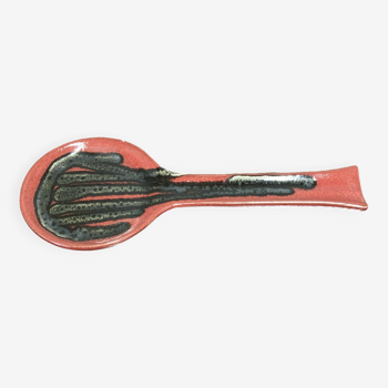 Red ceramic spoon holder.