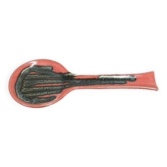 Red ceramic spoon holder.