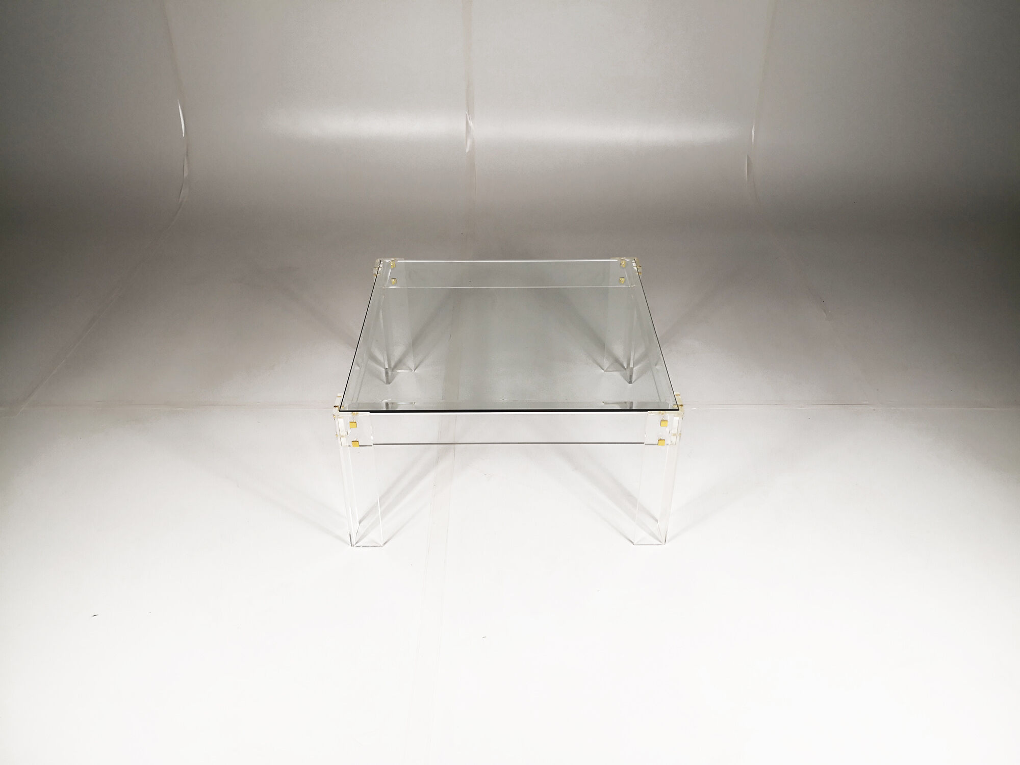 Table low plexiglas and brass, C.1980