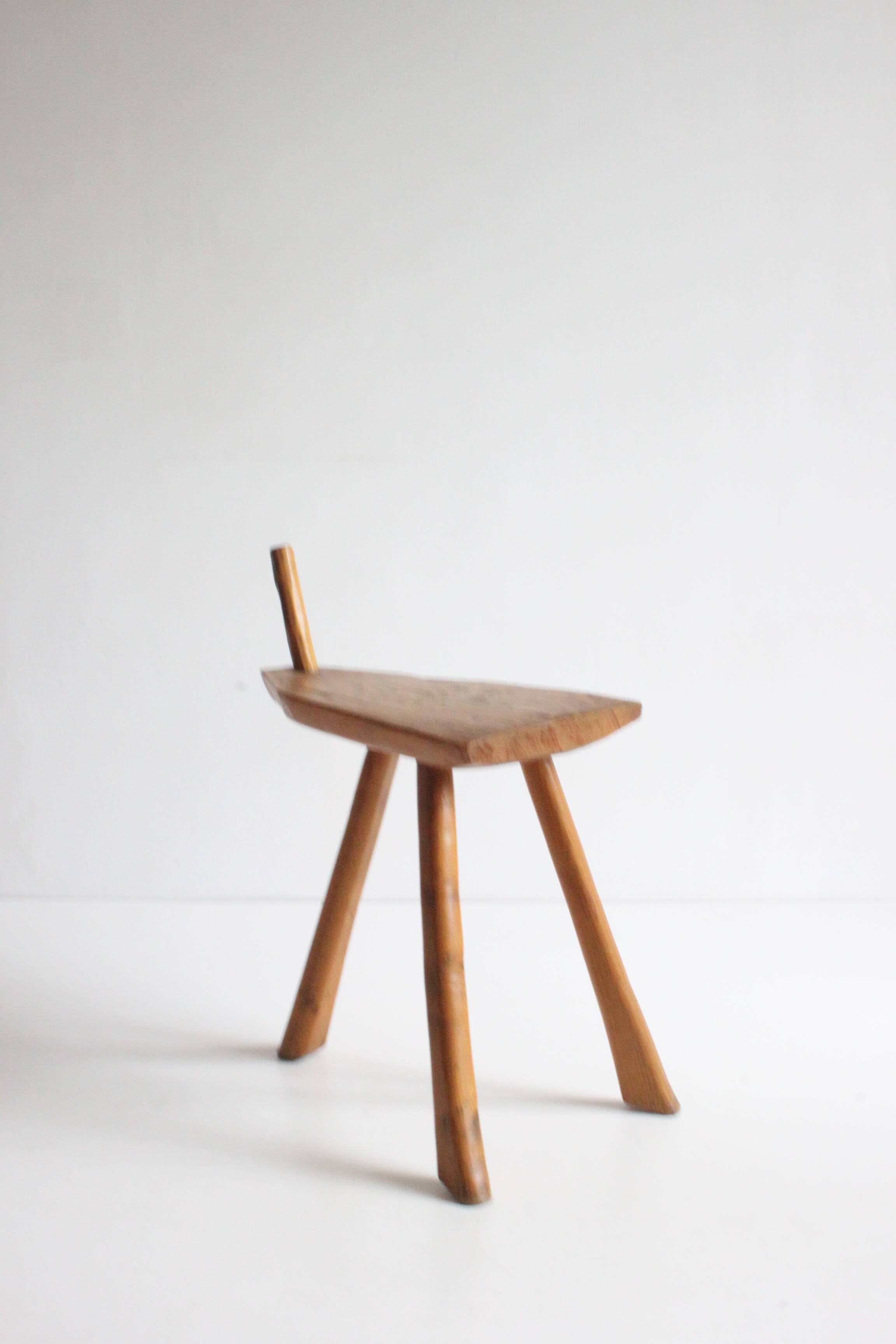 Brutalist tripod stool in carved wood, 1950s