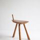 Brutalist tripod stool in carved wood, 1950s