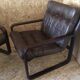 Pair of vintage armchairs in curved wood with suspended seat circa 1970-80.
