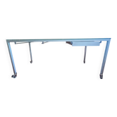Glass and metal desk with wheels
