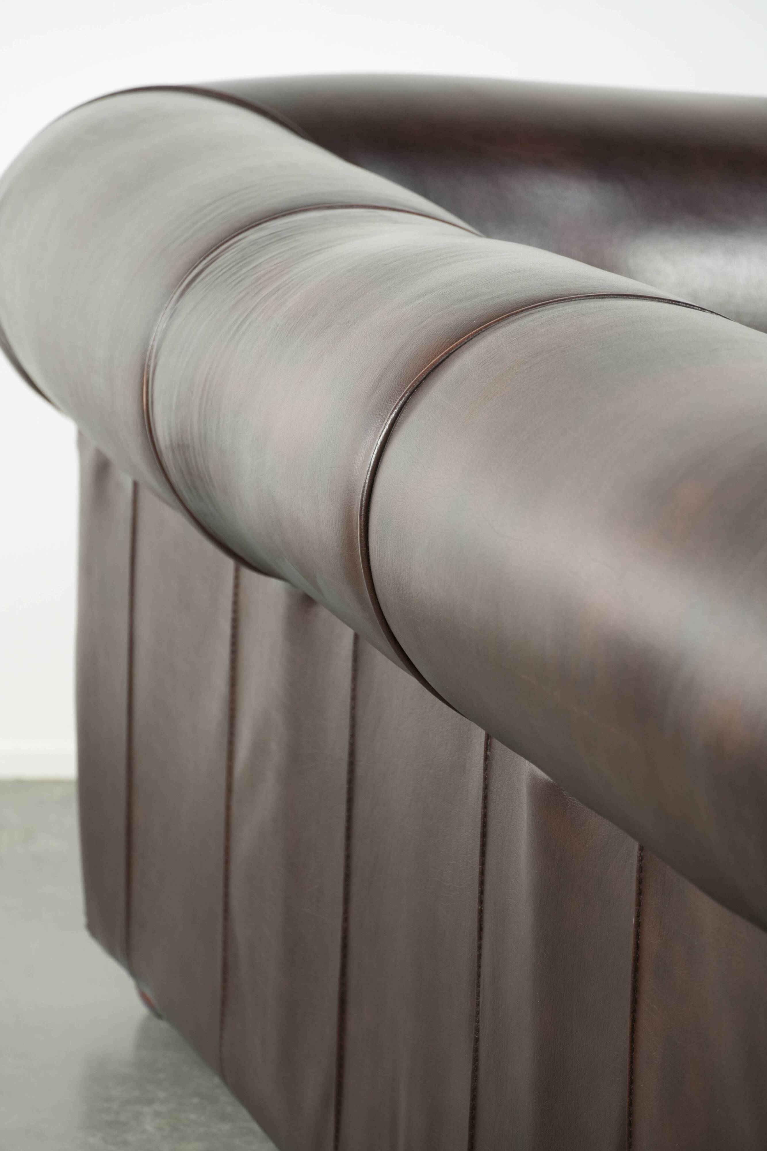 Luxury brown smooth cow leather Chesterfield sofa with an English look