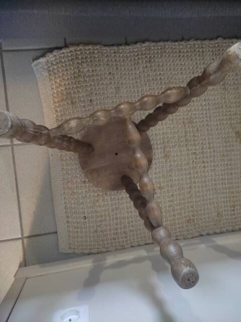 Solid wood stool with patinated varnished tripod legs