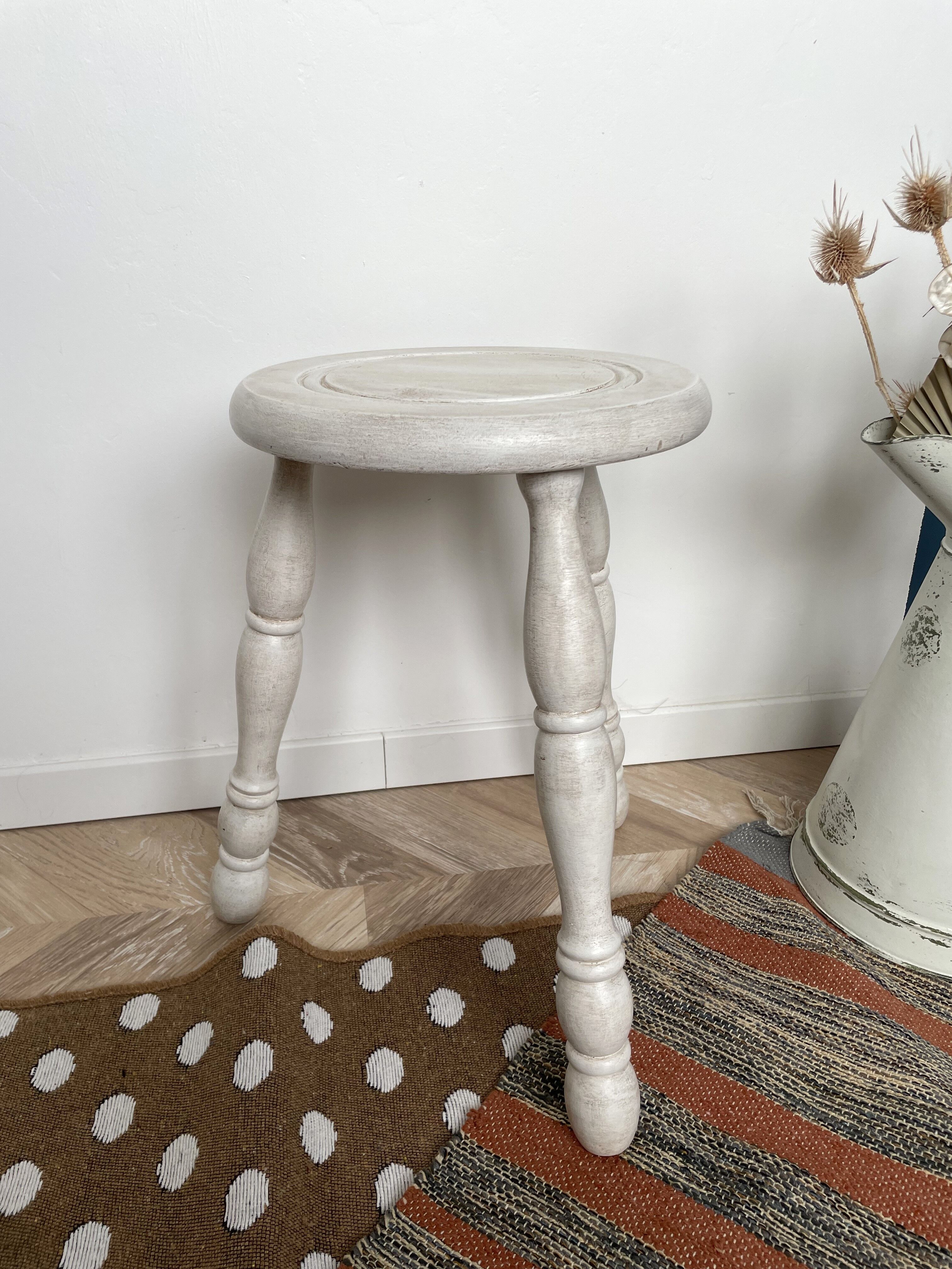 Patinated white tripod