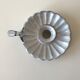 Candlestick in white enameled metal