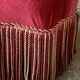 Old raspberry velvet toad armchair