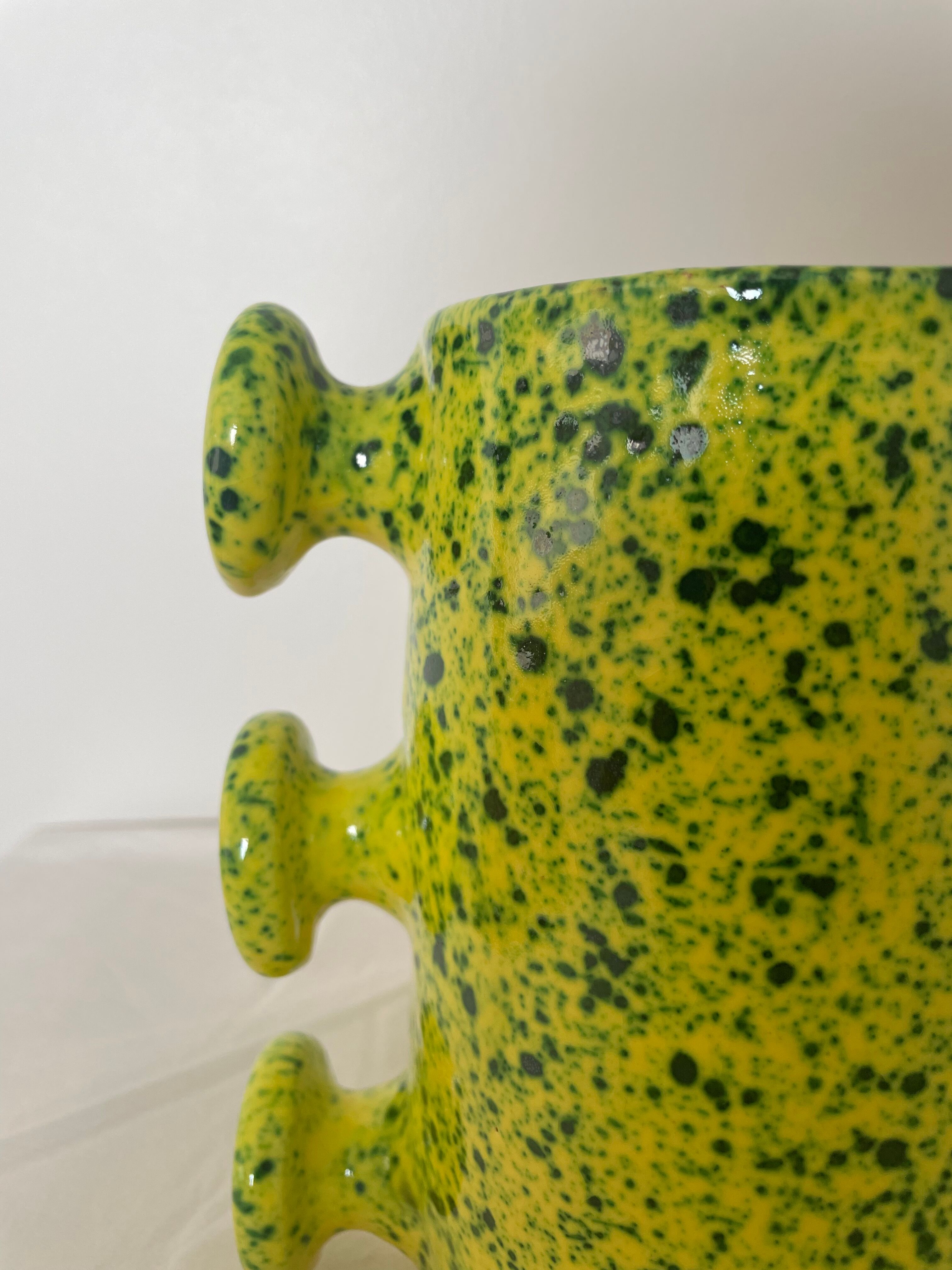 Handmade green speckled yellow ceramic vase with abstract handles