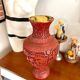 Asian metal vase and red resin
