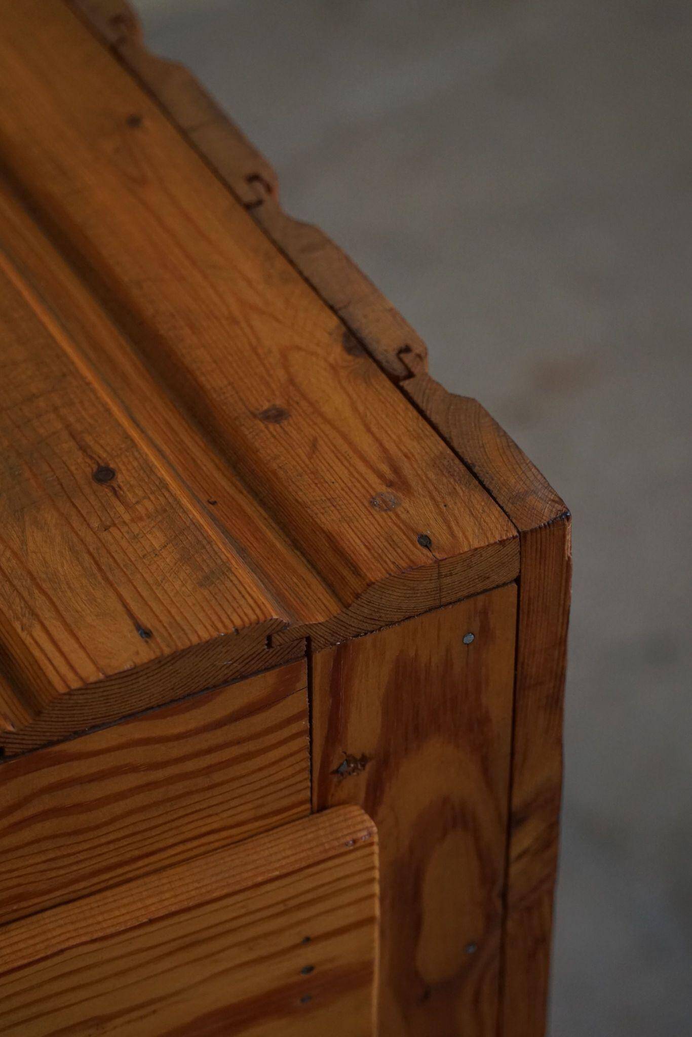 Free-standing primitive pine commode, mid-century Swedish, 1950s.