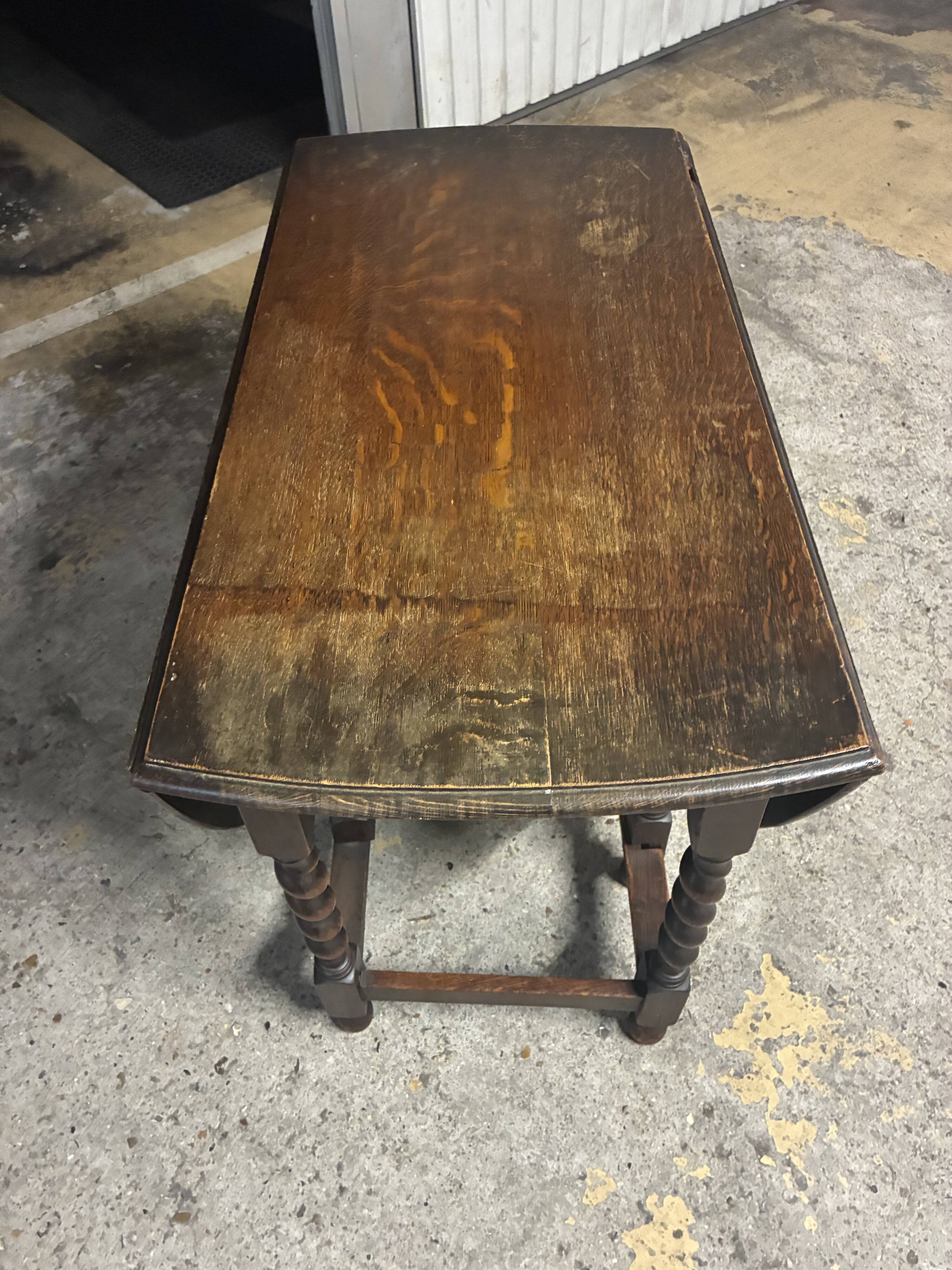 Folding wooden table with twisted legs