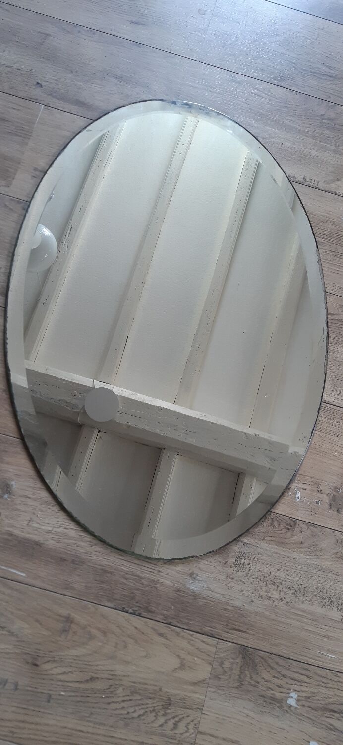 Beveled oval mirror