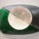 Green and black ceramic cup moist from the 1960s