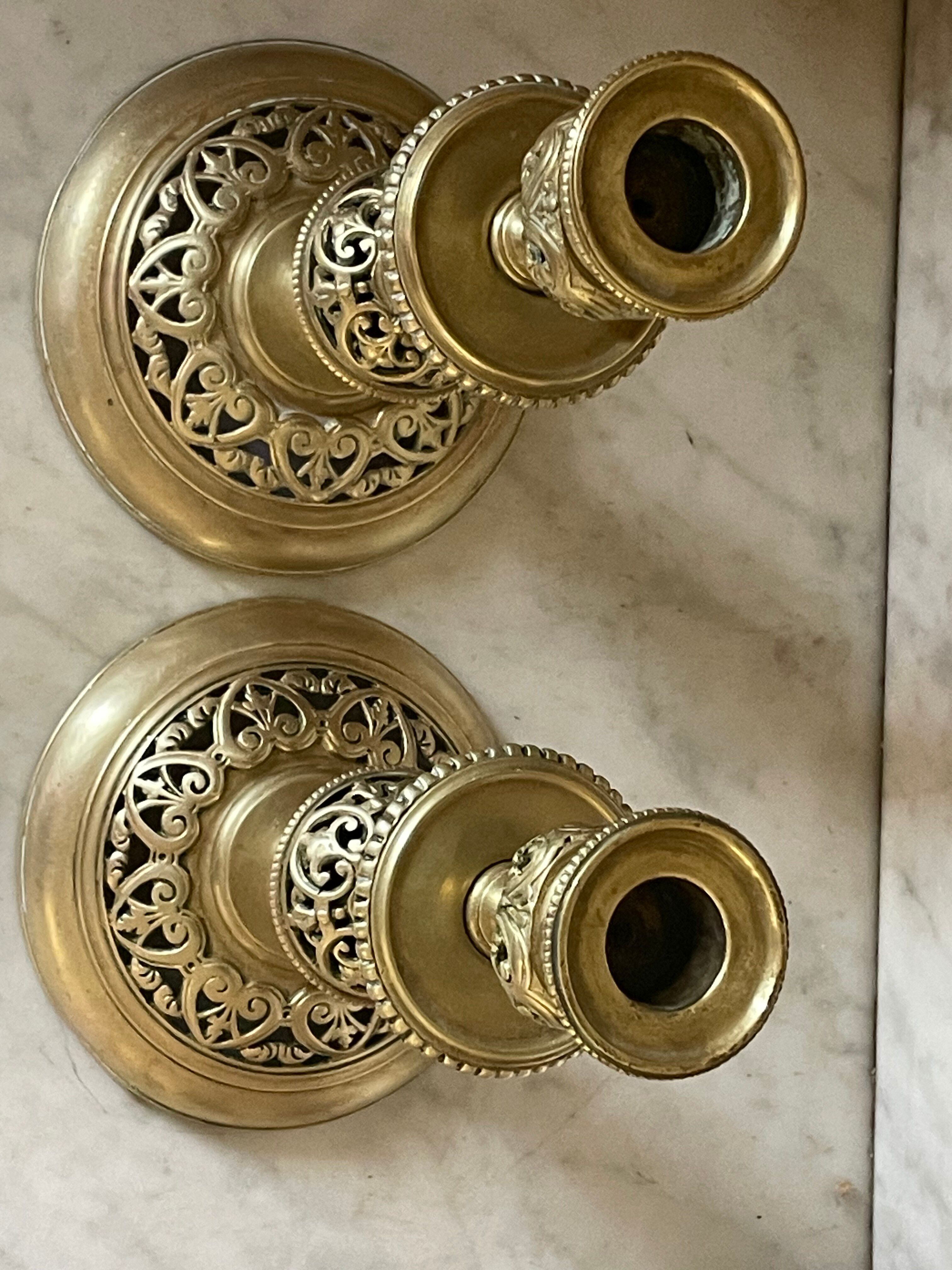 pair of openwork gilded brass candlesticks from the 19th century
