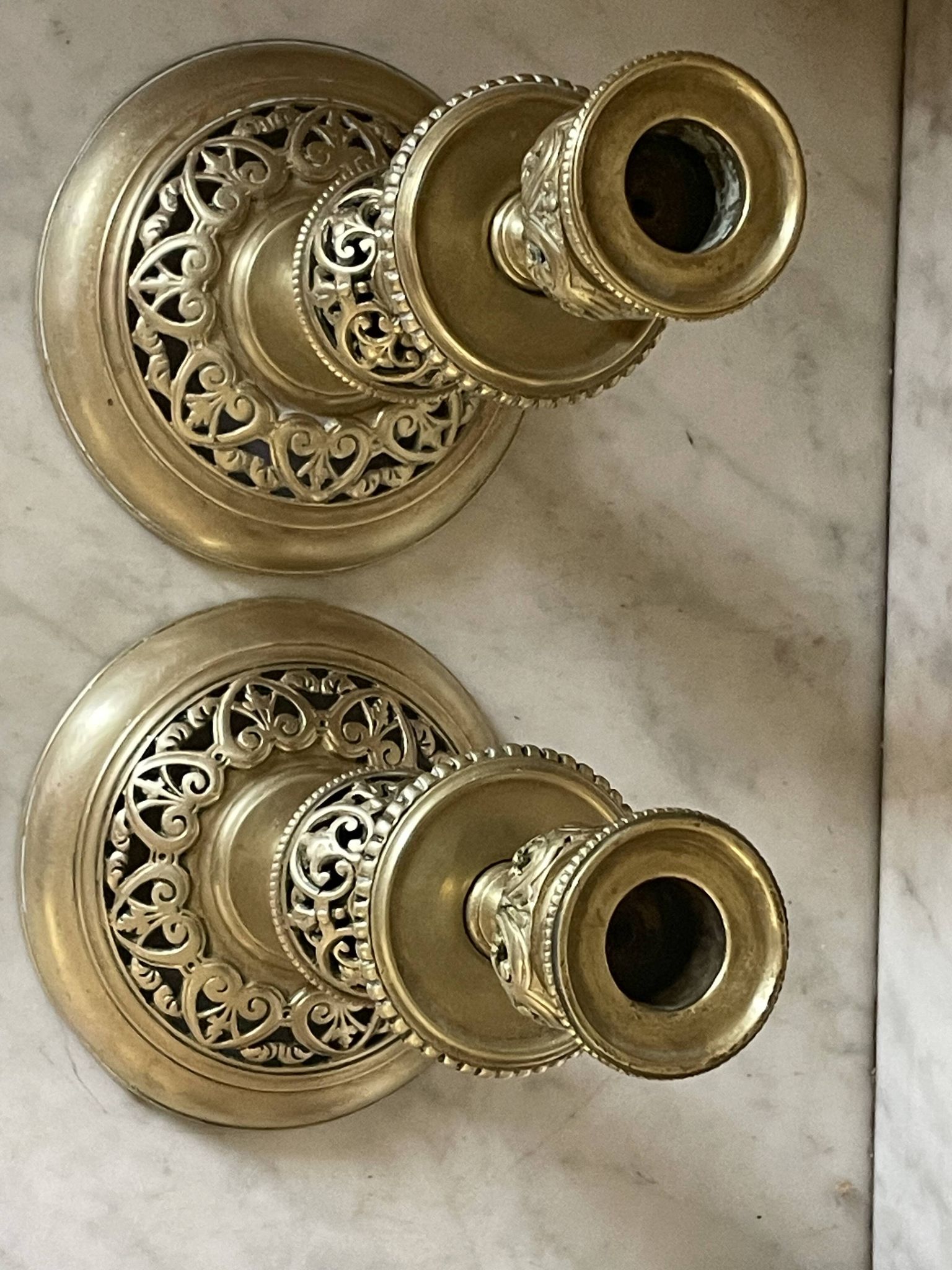 pair of openwork gilded brass candlesticks from the 19th century