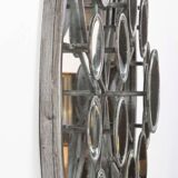 Mirror with round facets design