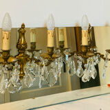 Pair of gilt bronze wall sconces with pendants from the mid-20th century.