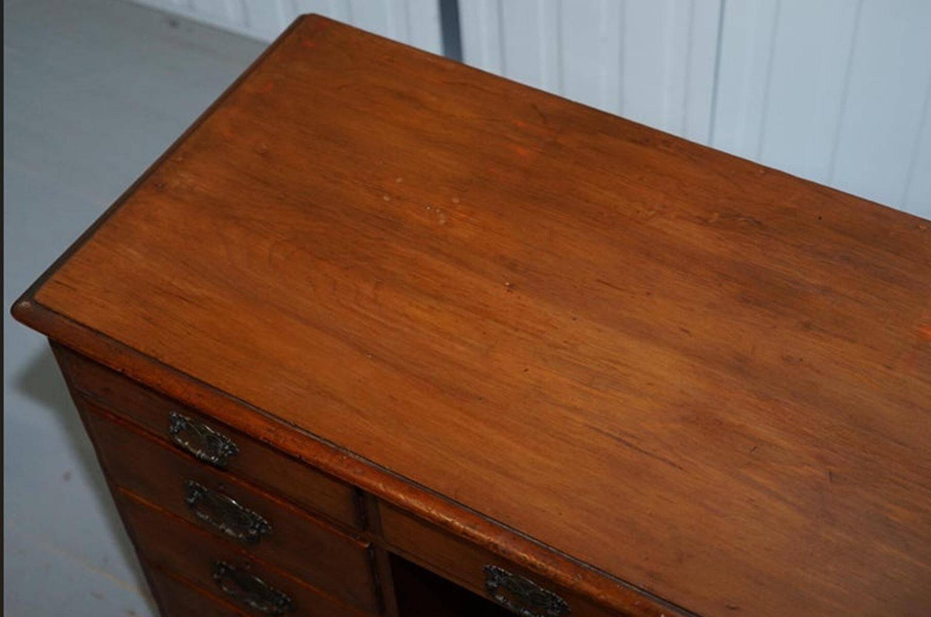 Small Victorian desk in solid walnut with drawers.