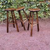Set of three brutalist tripod stools