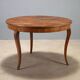 Table ronde élégante avec tiroir et pieds galbés