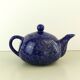 Blue glazed and speckled ceramic teapot