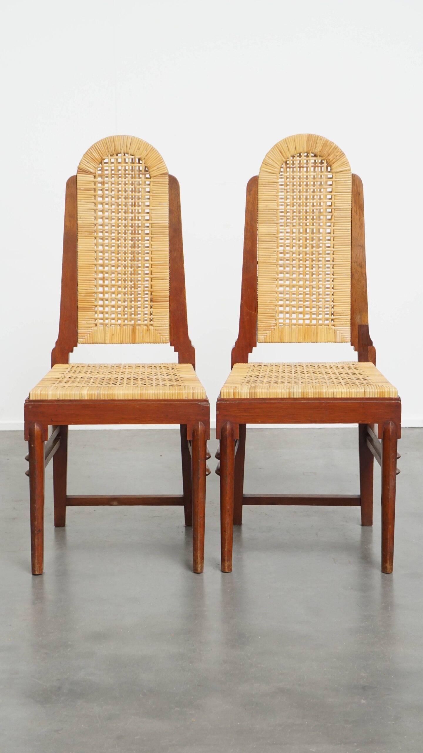 et of 6 wooden Art Deco design dining chairs with a wicker seat and backrest