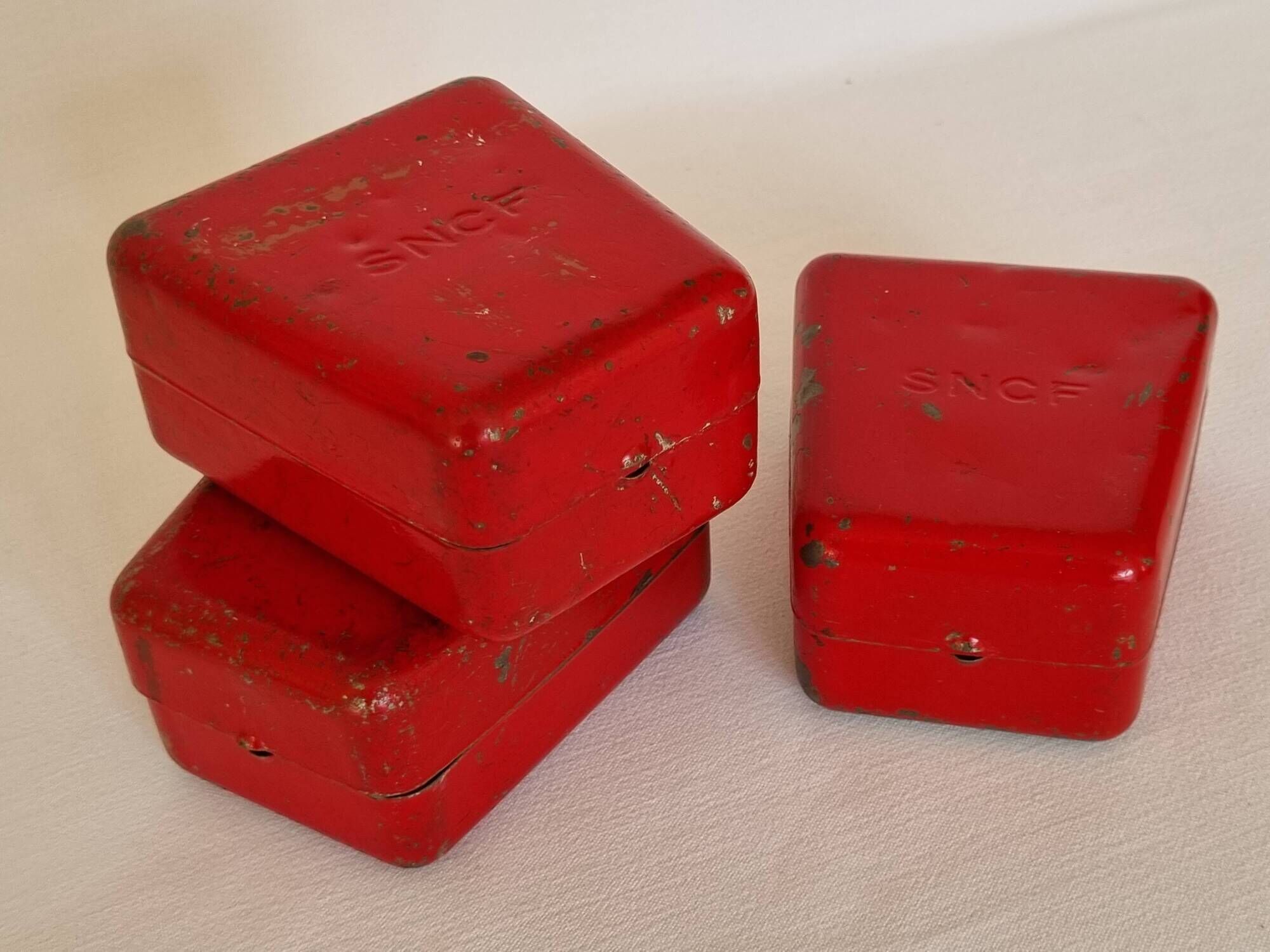 Set of three red painted metal railway boxes with SNCF logo