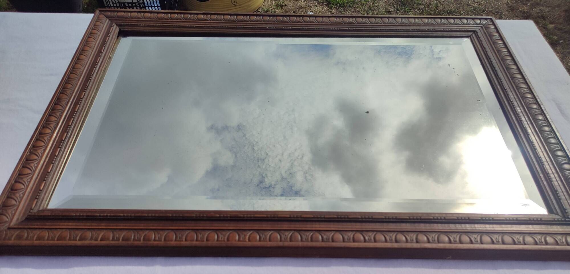Grand miroir ancien biseauté cadre en bois sculpté