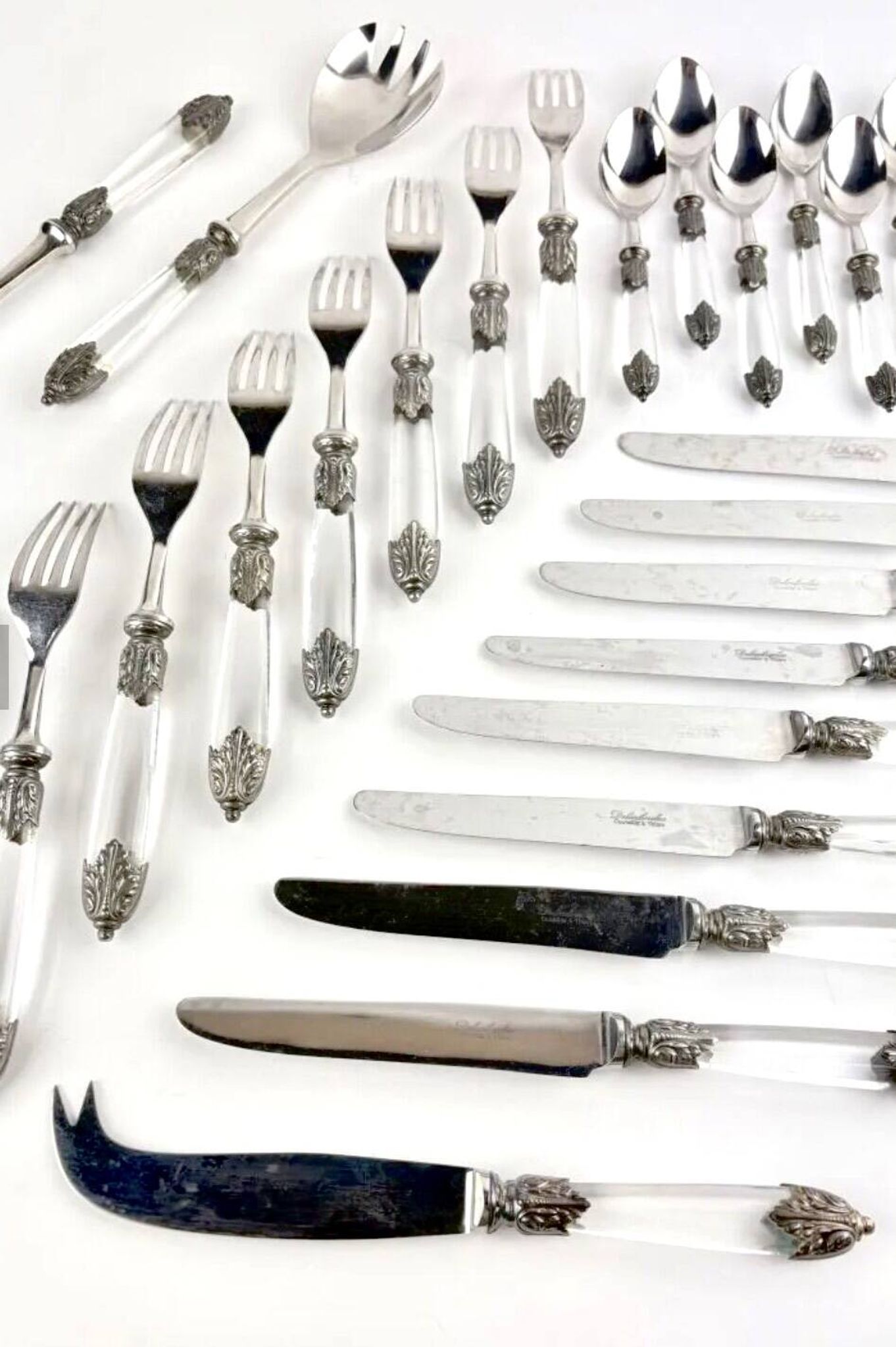 Silver-plated metal cutlery set, plexiglass and stainless steel.